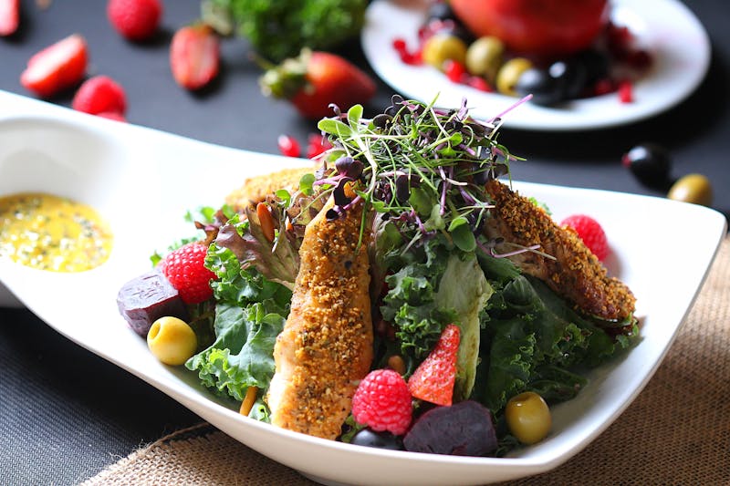 Grilled chicken salad with avocado and fresh greens