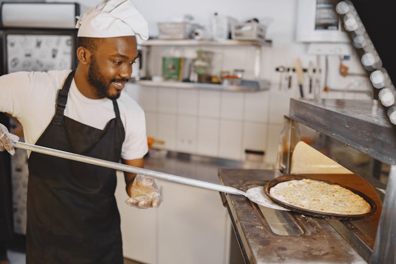 Imos Pizza team working together in the kitchen